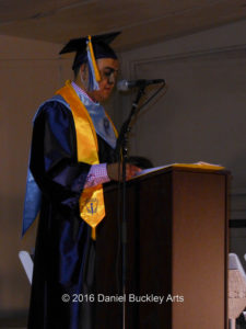 Mariachi Aztlan group leader Daniel Motley reads his valedictorian address.