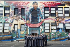 Members of the class of 2014/15 of Pueblo's Mariachi Aztlan pose at Cesar Chavez Elementary School in San Francisco after a performance there for students.