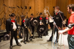 Petie Ronstadt, (r), sets microphones for the Aguilitas trumpet players.