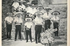 Original members of Los Changuitos Feos w. Father Charles Rourke.